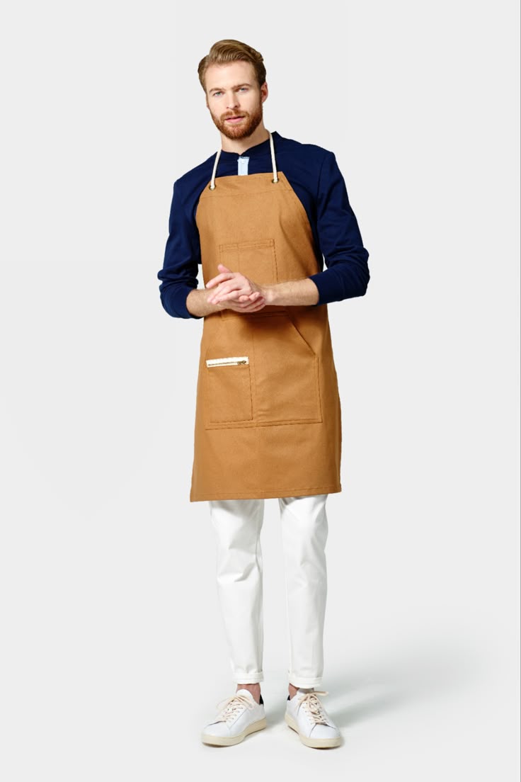 Coordinated uniform system visually distinguishing staff roles while maintaining brand consistency